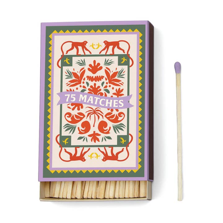 Matchbox with colorful design and '75 Matches' text on a white background