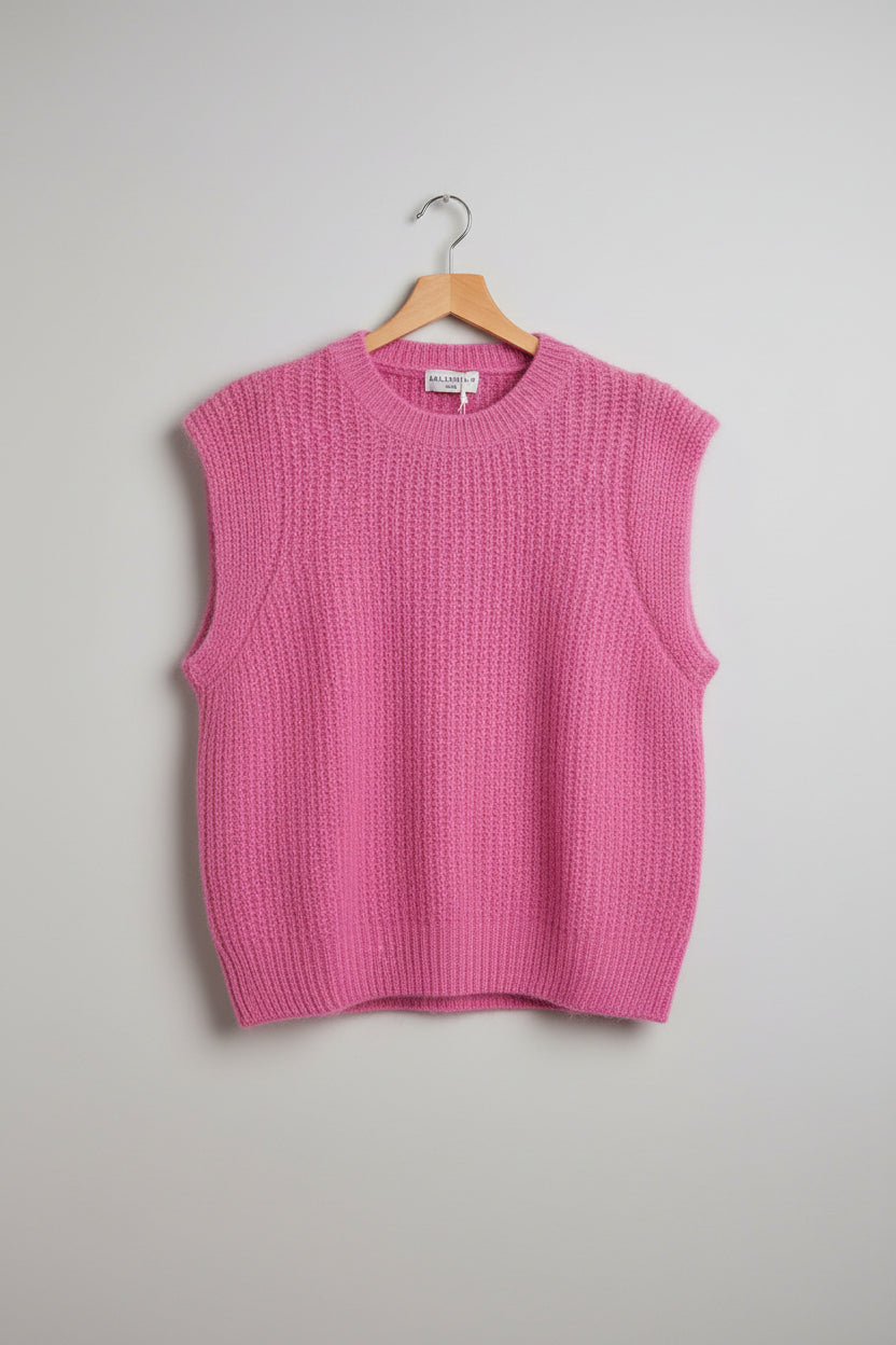 Pink sweater on a hanger on a grey background
