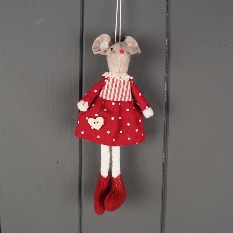 Decorative mouse figurine in a red dress with white polka dots on a gray background