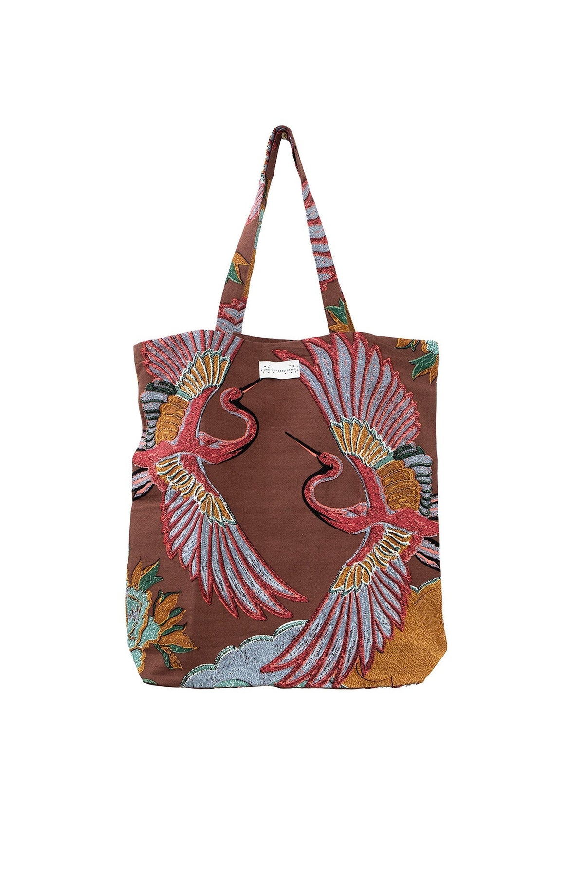 Tote bag with bird design on a brown background
