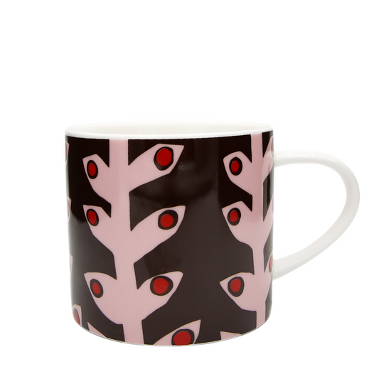 Mug with a pink and red abstract design on a black background