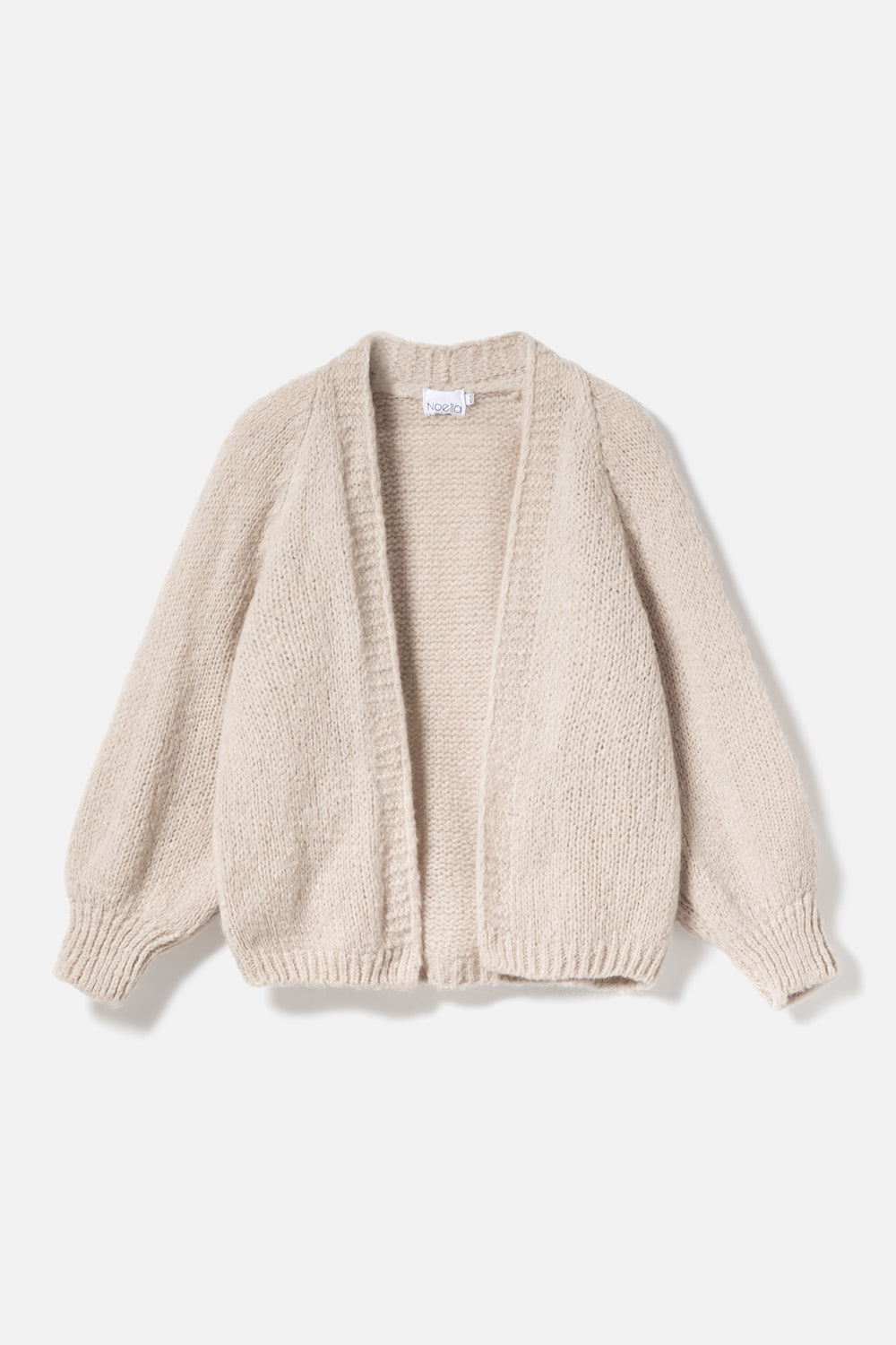Noella Fora Knit Cardigan in Sand. Beige cardigan on a light beige background