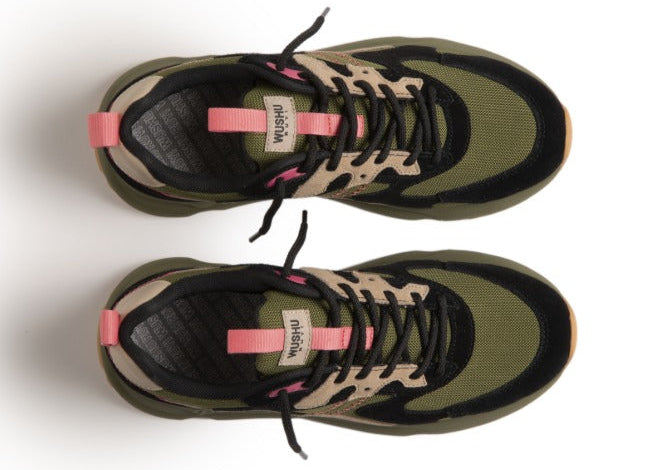 Pair of green and black sneakers with pink accents on a white background