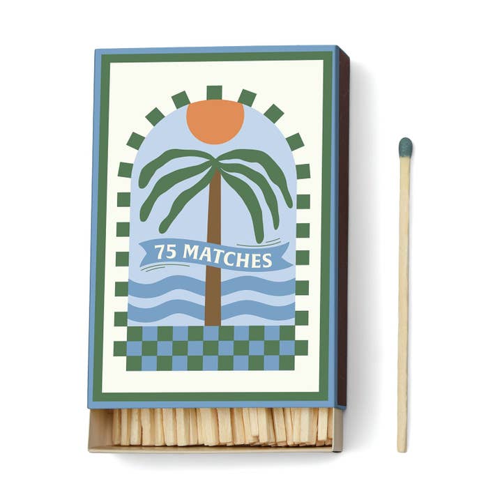 Matches with a decorative matchbox featuring a palm tree design.