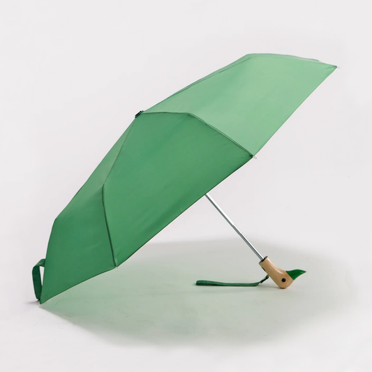 Original Duckhead Matcha Compact Duck Umbrella - a green folding umbrella shown open on a clean white studio background, with a light wood handle and a small green loop detail near the base.