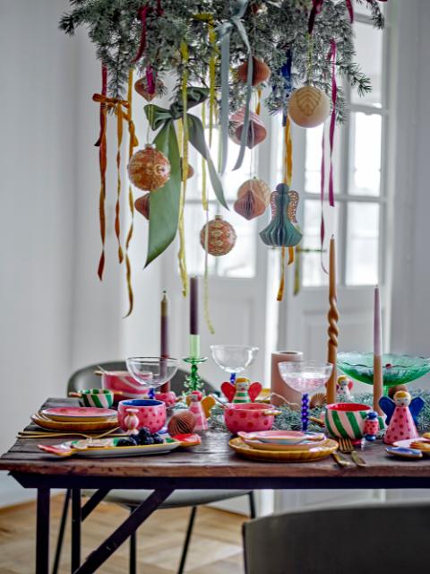Christmas Hanging Decorations above a Christmas Themed  Dining Table 