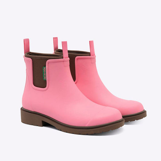 Merry People Bobbi Wellington Boot in Musk Pink - a pair of pink Chelsea-style rain boots with brown soles and elastic side gore, shown on a clean white background.