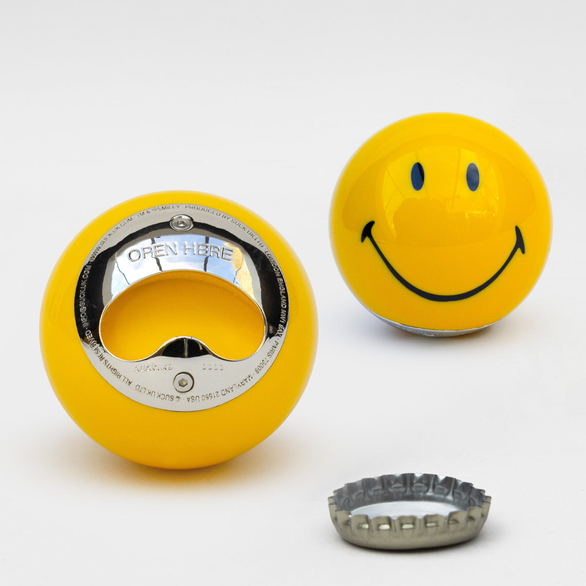 Smiley Bottle Opener - a yellow smiley face bottle opener with a silver base on a white background