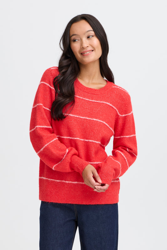 Woman wearing a red striped sweater on a white background