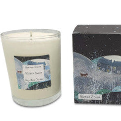 Candle with packaging featuring a winter scene design.