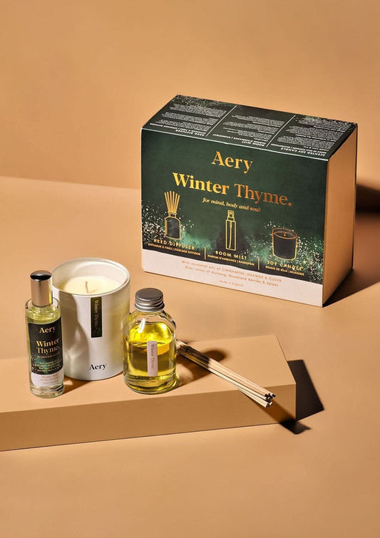 Aery Winter Thyme product set including a candle, essential oils, and diffuser on a beige background