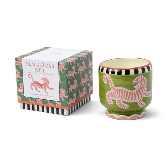 Candle with tiger design and packaging on a white background