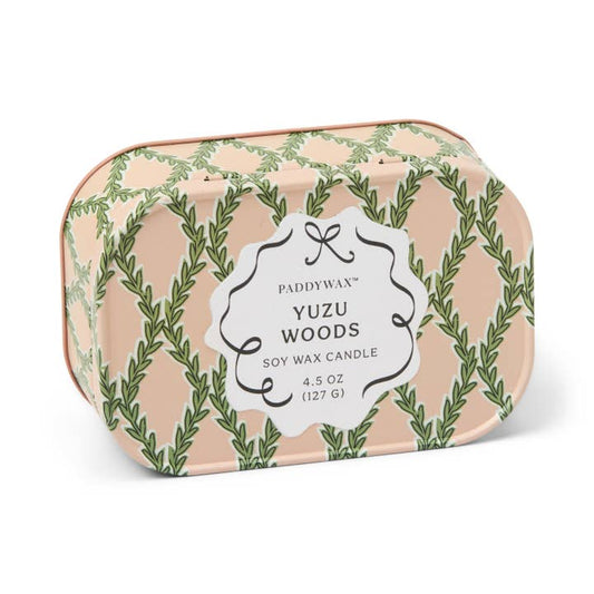 Paddywax Yuzu Woods candle in a decorative tin with green leaf pattern on a white background