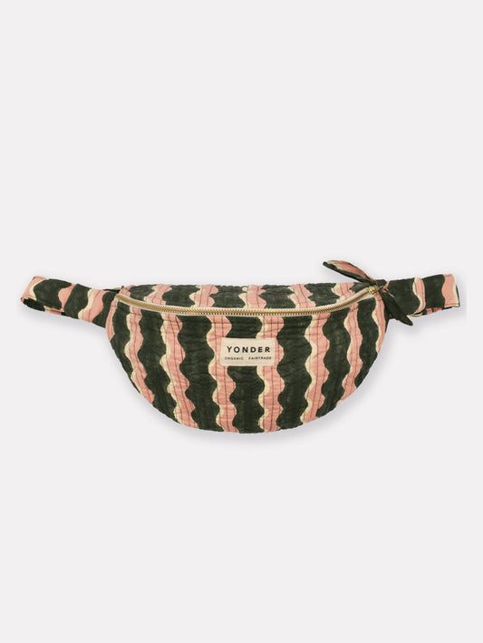 A YONDER brand fanny pack featuring a wavy, zig-zag striped pattern in dark green and dusty pink, with a gold zipper and a white brand label on the front.