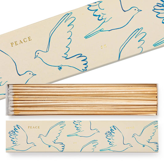 Incense sticks with decorative packaging featuring dove illustrations and the word 'Peace'.