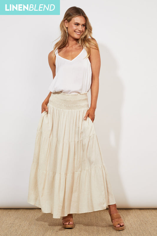 Haven Tanna Maxi Skirt in Sant with white wide strap vest and nude sandals