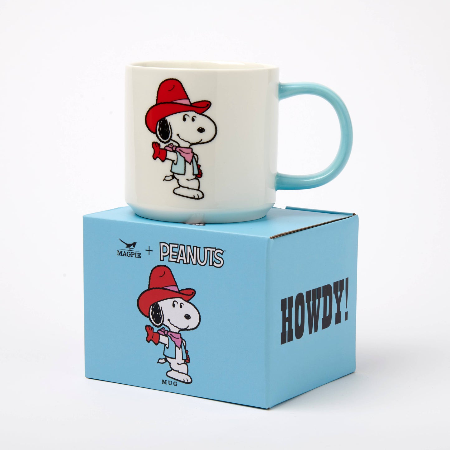 Mug with cartoon character on a blue box labeled 'Peanuts' and 'Howdy!'