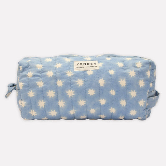 Blue pouch with white floral pattern and 'Yonder' branding on a white background