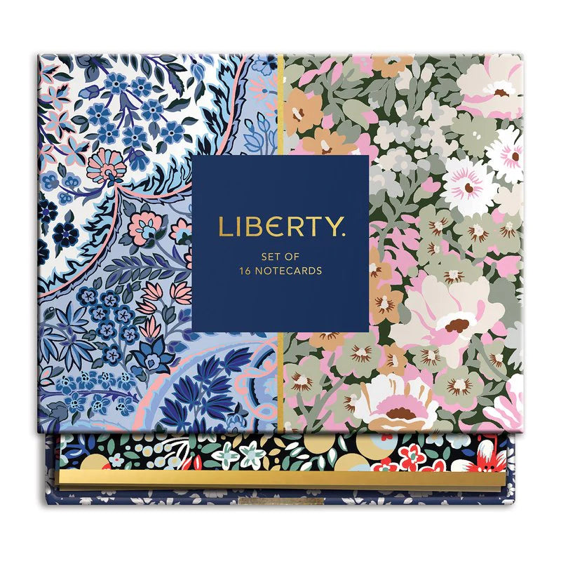 A set of 16 Liberty London notecards with floral and graphic patterns in a variety of colors, displayed in an open box with the Liberty brand visible.