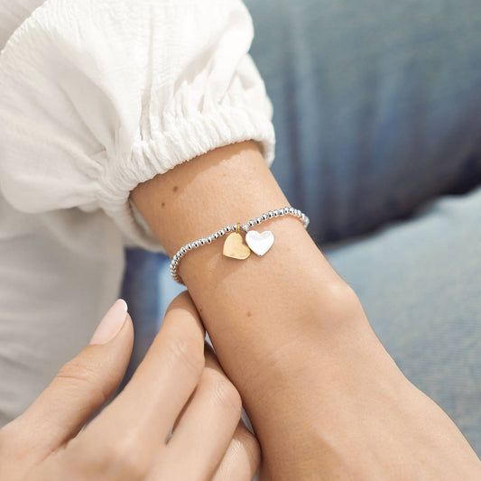 A Little 'Soul Sisters' Bracelet with both a gold and a silver heart charm