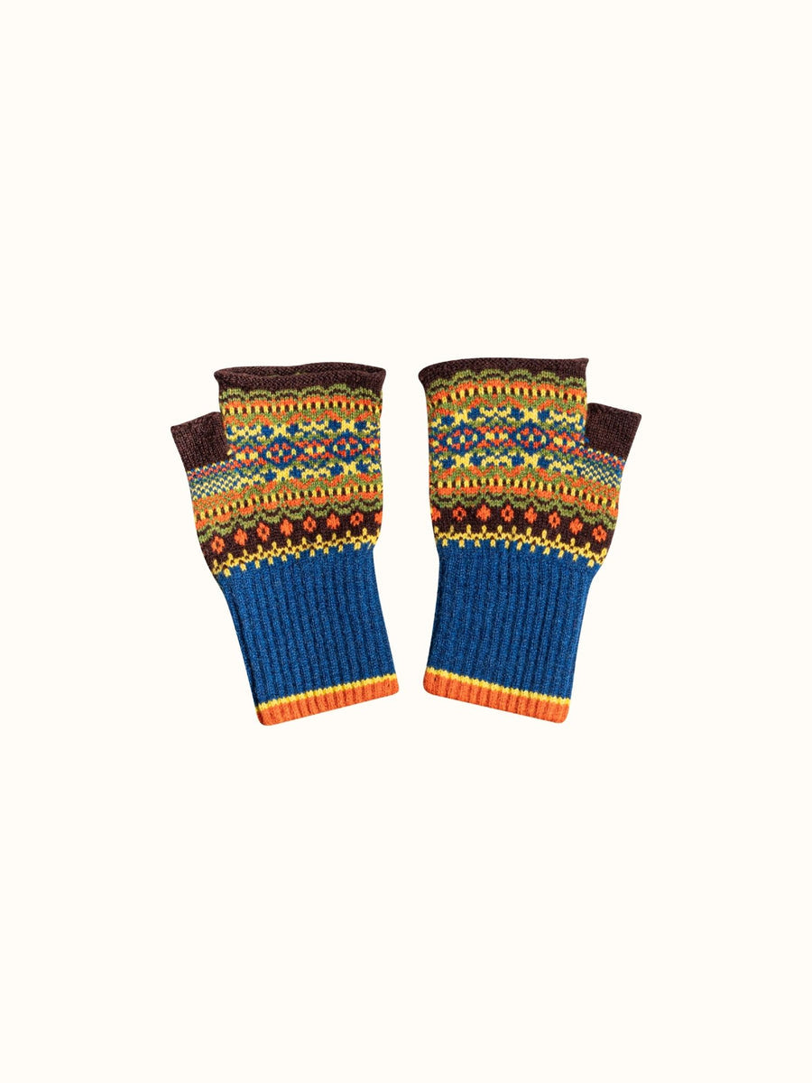 A pair of fingerless knit gloves with a multicolor Fair Isle pattern on the upper half and solid blue ribbed cuffs on the lower half, displayed against a plain off-white background.