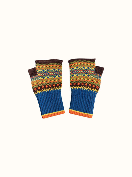 A pair of fingerless knit gloves with a multicolor Fair Isle pattern on the upper half and solid blue ribbed cuffs on the lower half, displayed against a plain off-white background.