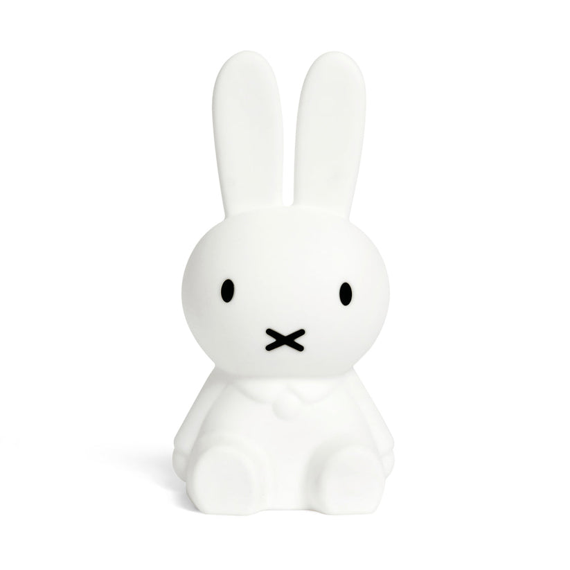 White rabbit-shaped night light with black facial features on a white background