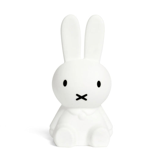 White rabbit-shaped night light with black facial features on a white background
