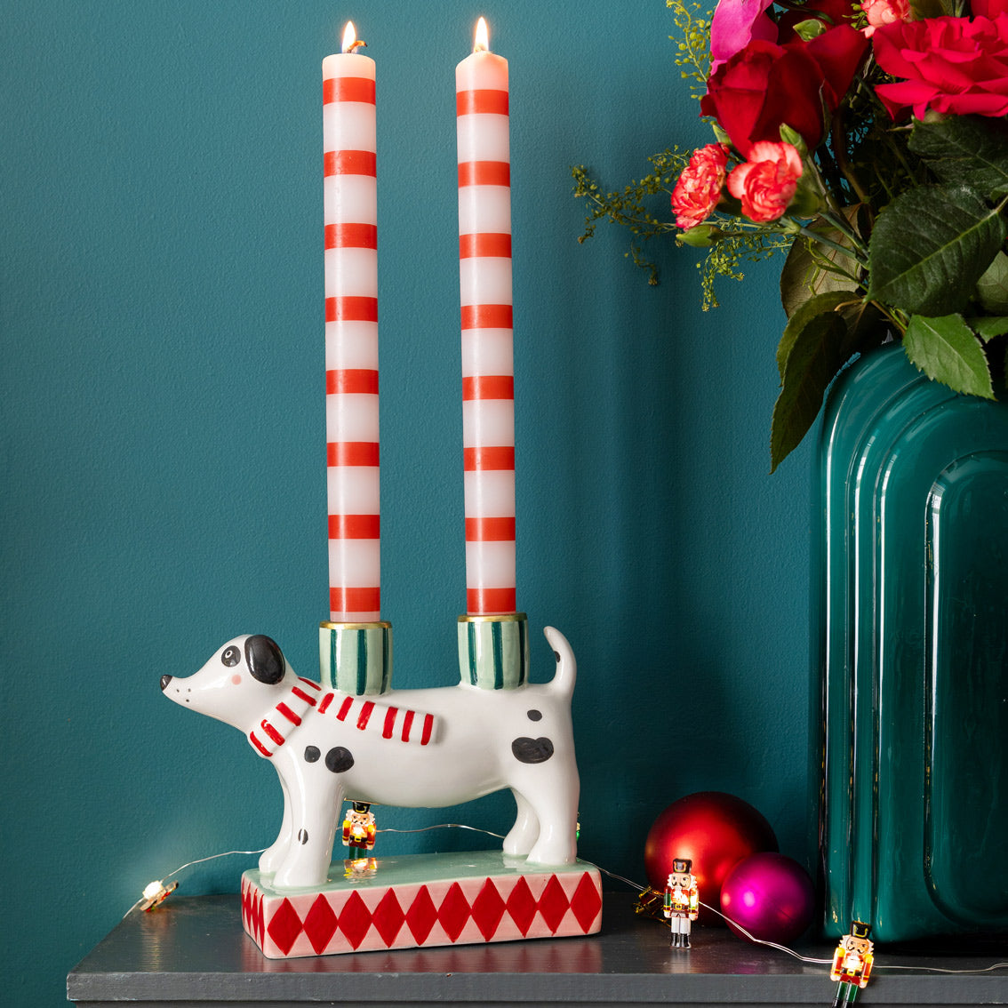Hand-Painted Dog Candle Holder - decorative candle holder shaped like a dog with striped candles and flowers on a teal background