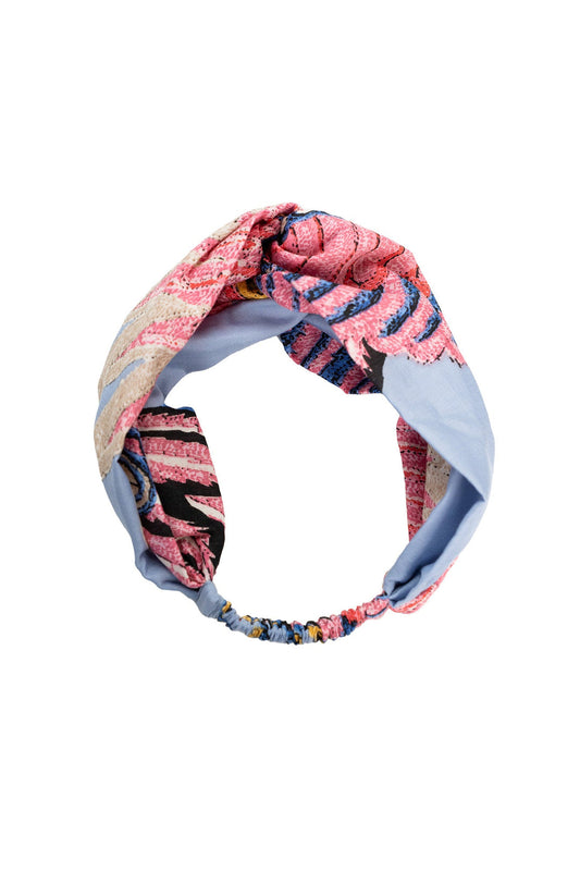 Classic Crane print headband features graceful pink and orange cranes set against a periwinkle blue base