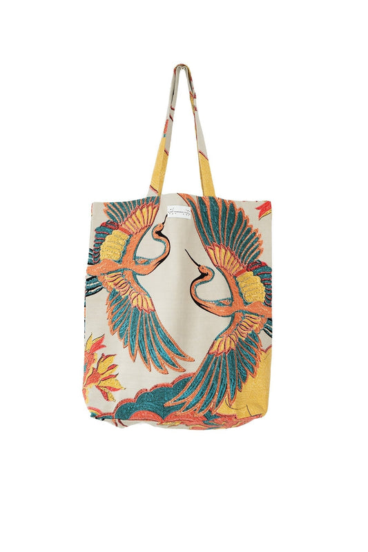 Tote bag with bird design on a white background