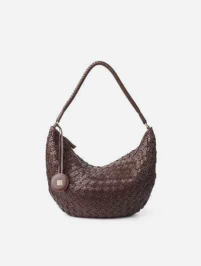 Washed, braided and die-cut cowhide medium hobo bag. Shoulder strap
