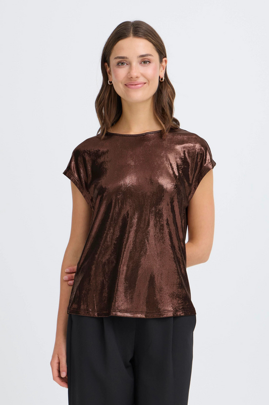 Woman wearing a chocolate brown metallic top on a white background