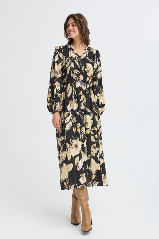 Fransa Ariana Dress 14 in DIS FLORAL. Woman wearing a floral dress with long sleeves on a white background