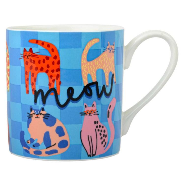 A white ceramic mug featuring a playful blue checkered pattern background with whimsical cartoon cats in orange, pink, and blue, and the word 'meow' written in black script across the front.