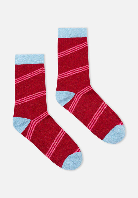 Red socks with pink stripes and light blue accents on a white background