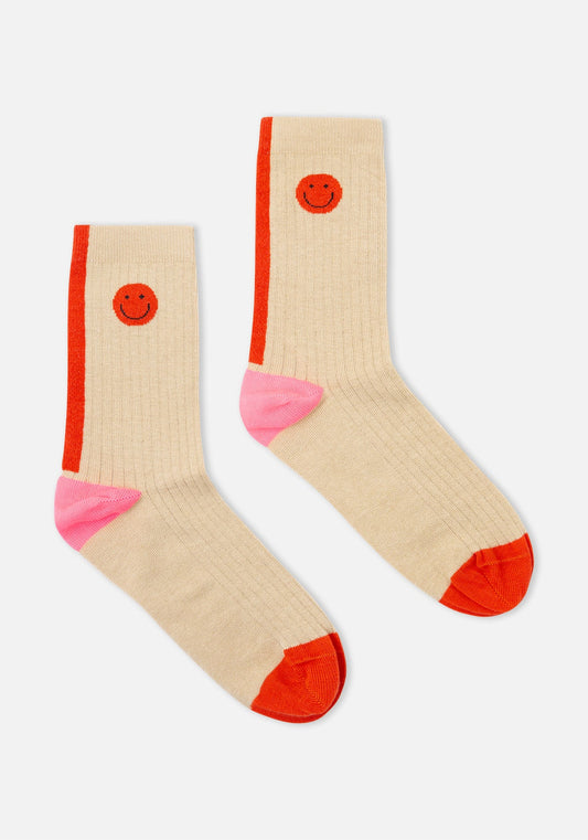 Beige socks with red and pink accents on a white background