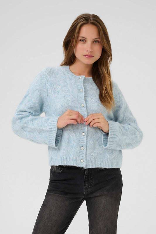 Kaffe Martha Cardigan in Windward Blue. Woman wearing a light blue knitted cardigan against a white background