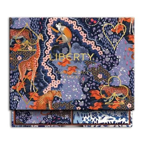 Liberty London fabric swatch book with colorful animal and floral pattern on a white background