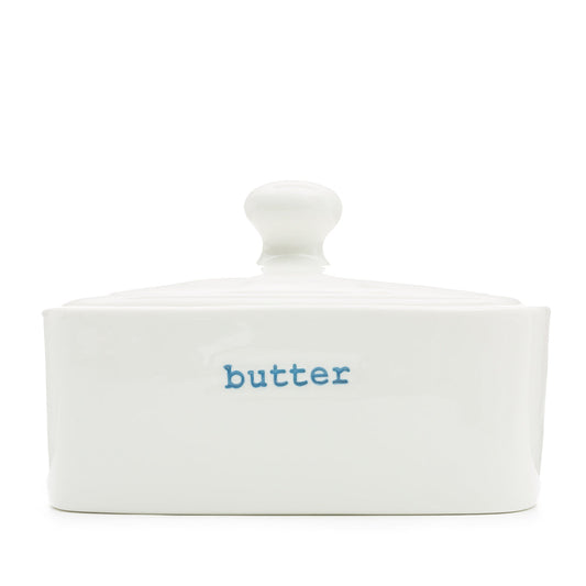 White ceramic butter dish with 'butter' label on a white background