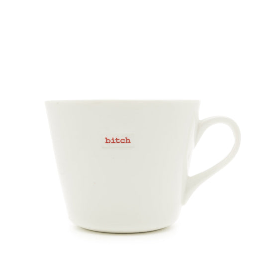 White mug with 'b***h' printed in red on a white background