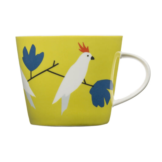 Yellow mug with a white bird design on a white background