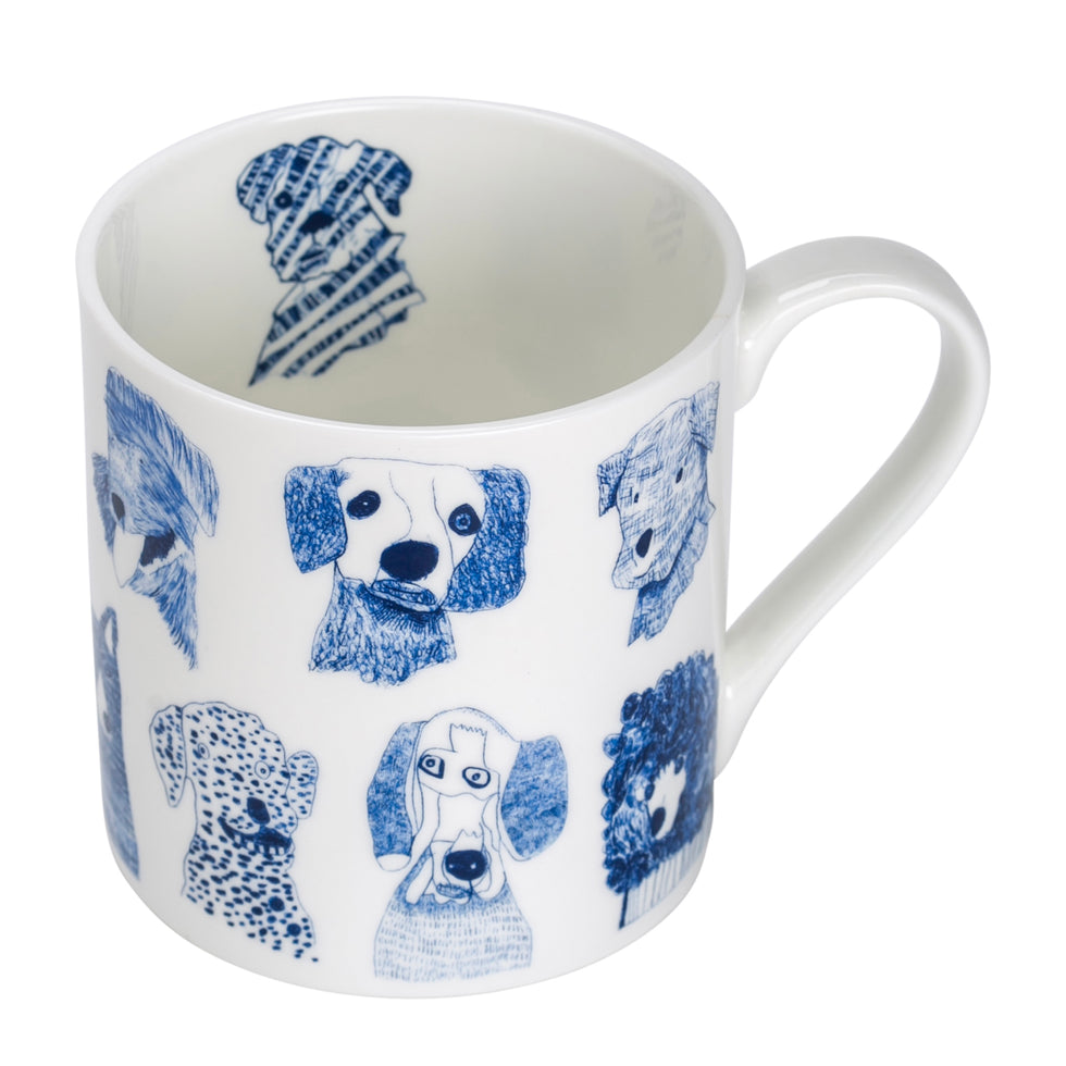 White mug with blue dog illustrations on a white background