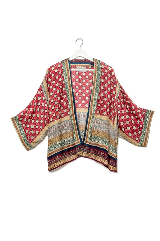 a short kimono with 3/4 length sleeves and a pretty print in burgundy and red hues