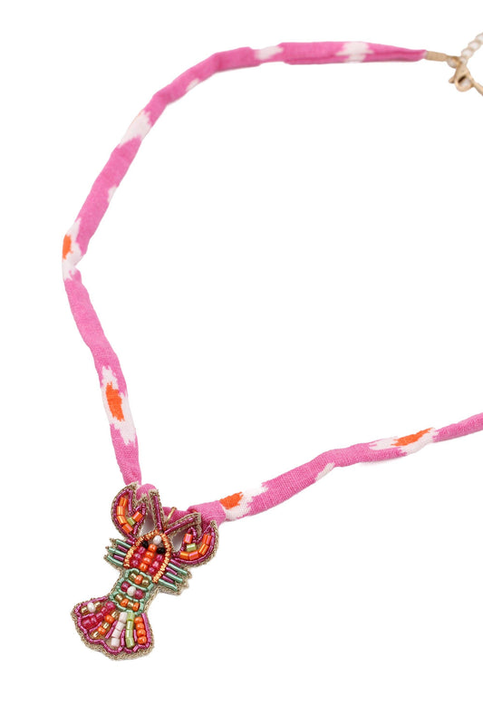 My Doris Necklace with colourful beaded pendant on a pink and white striped cord against a white background