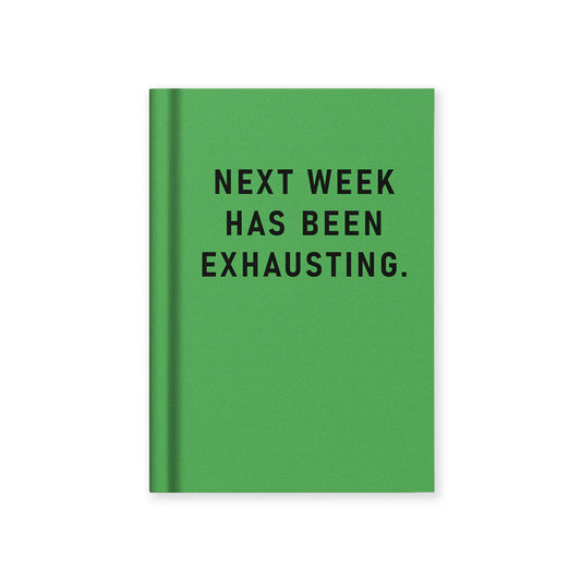 Green notebook with black text 'NEXT WEEK HAS BEEN EXHAUSTING.' on a white background