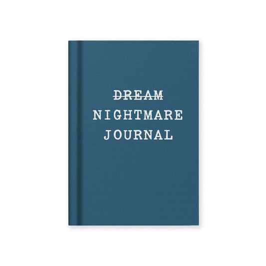 Blue journal with 'Dream Nightmare Journal' text on a white background