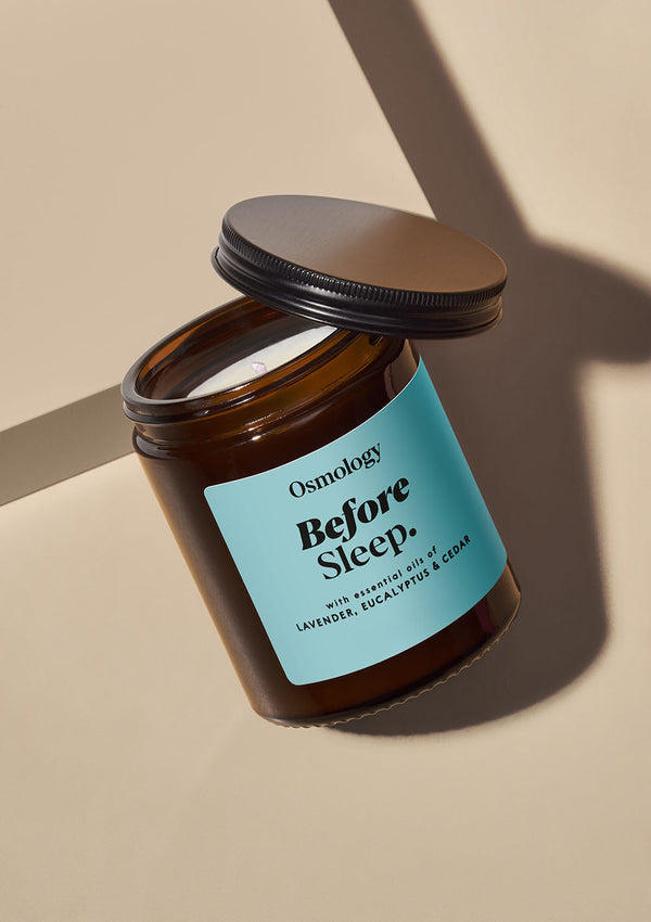Osmology 'Before Sleep' candle jar on a beige background