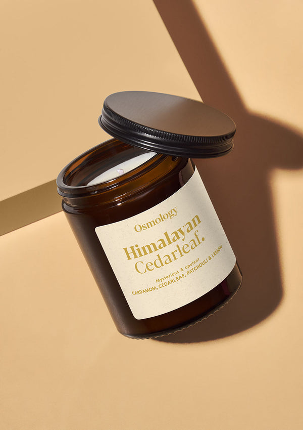 Osmotology Himalayan Cedarleaf candle on a beige background