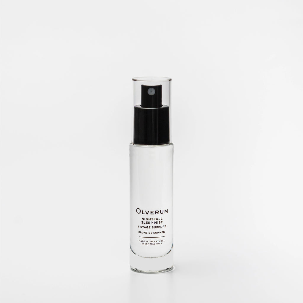 Clear spray bottle with black cap labeled 'Olverum' on a white background